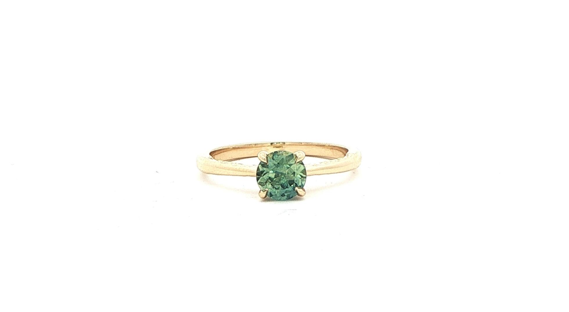 Estate Piece: Green Montana Sapphire Solitaire Ring with Engraved Details on side Profile in Yellow Gold (0.75cts)