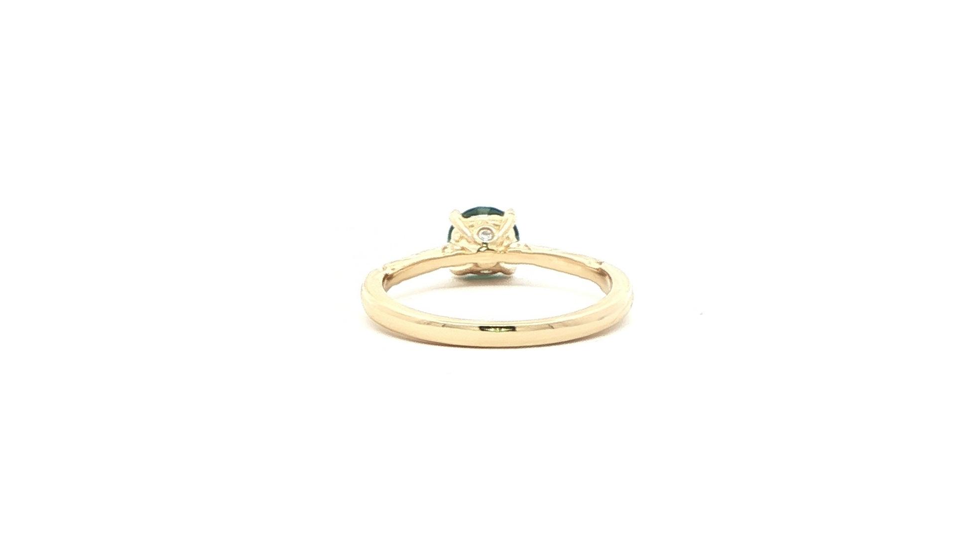 Estate Piece: Green Montana Sapphire Solitaire Ring with Engraved Details on side Profile in Yellow Gold (0.75cts) back