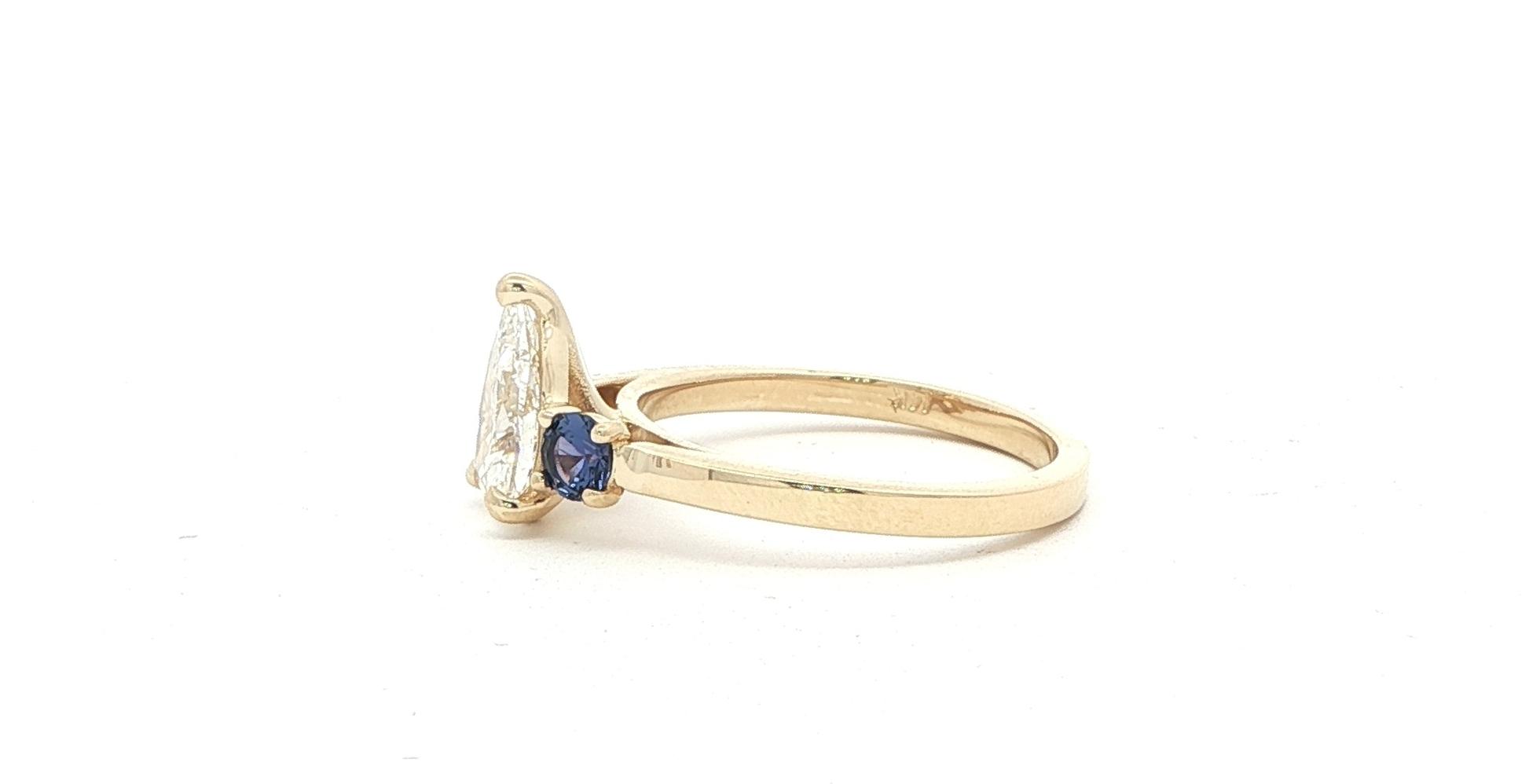 3-Stone Pear Shaped Diamond and Round Montana Yogo Sapphire Ring in Yellow Gold (1.41cts TWT) side