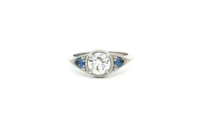 content/products/3-Stone Diamond and Pear-cut Montana Yogo Sapphire Engagement Ring with Milgrain Details in Platinum (1.32cts TWT)
