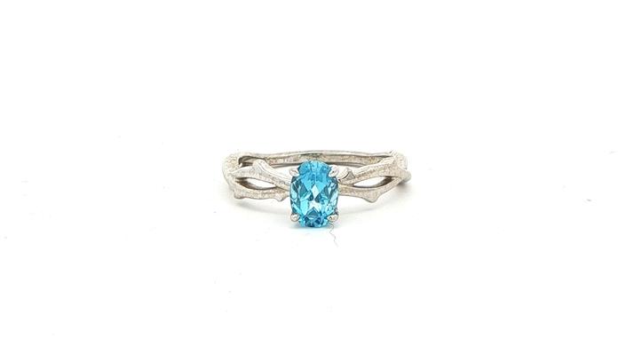 content/products/Twining Vines Oval Cut Blue Topaz Solitaire Ring in  White Gold