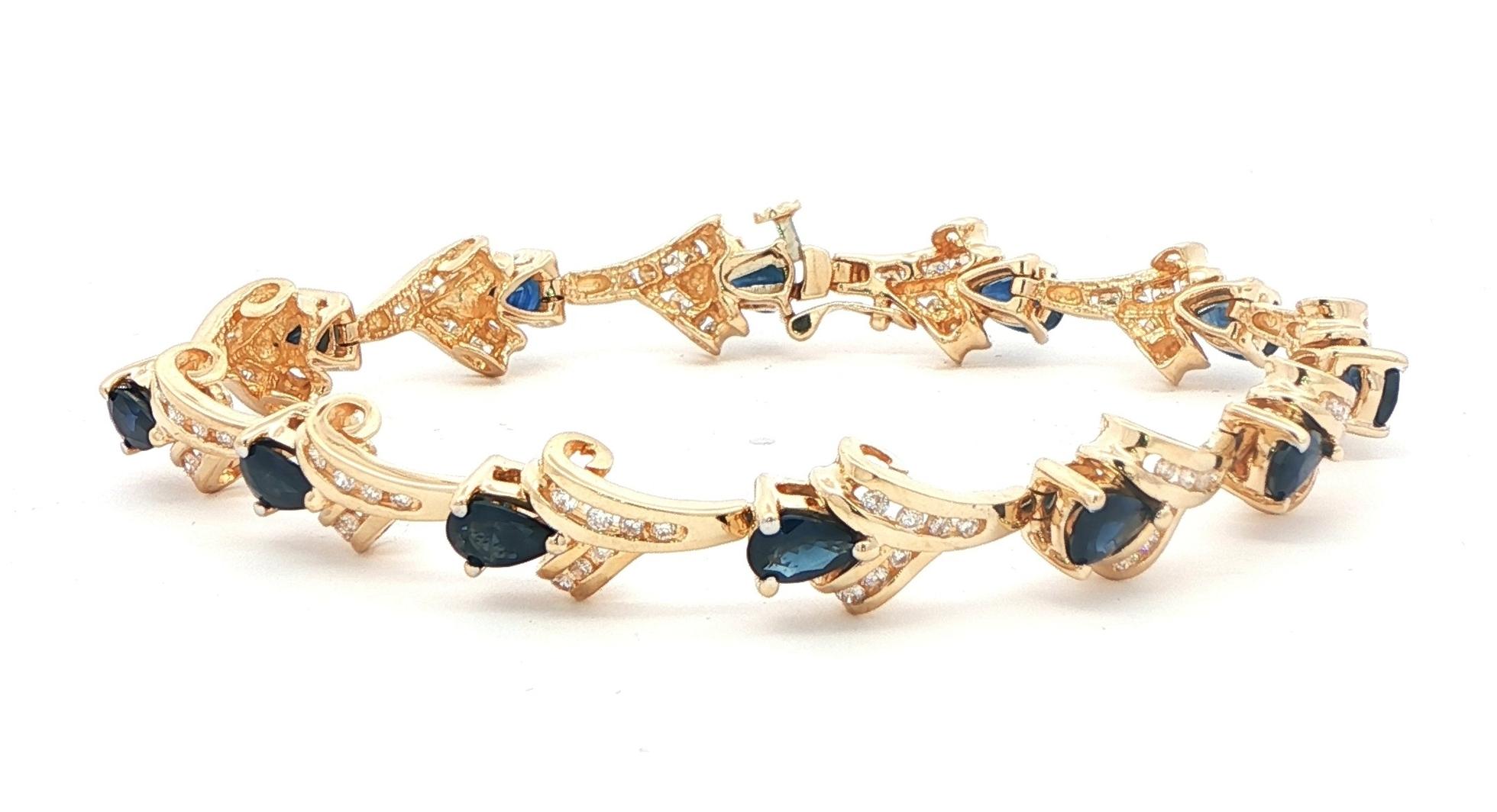 Estate Piece: Pear-Cut Blue Sapphire and Diamond Scroll Link Bracelet in Yellow Gold (7.26cts TWT)