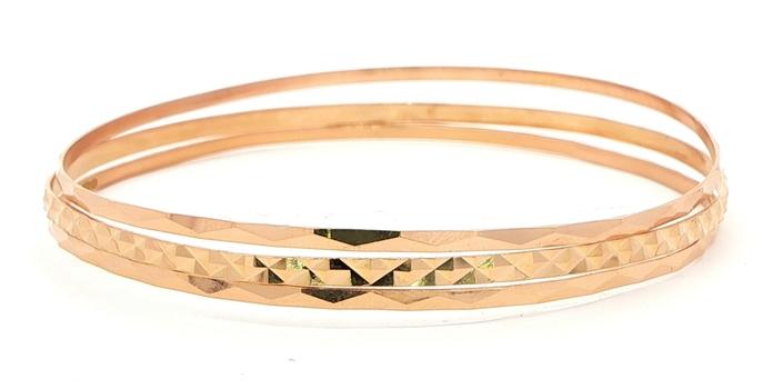 content/products/Estate Piece: Triple Stacked Diamond-Cut Bangle Set in Yellow Gold