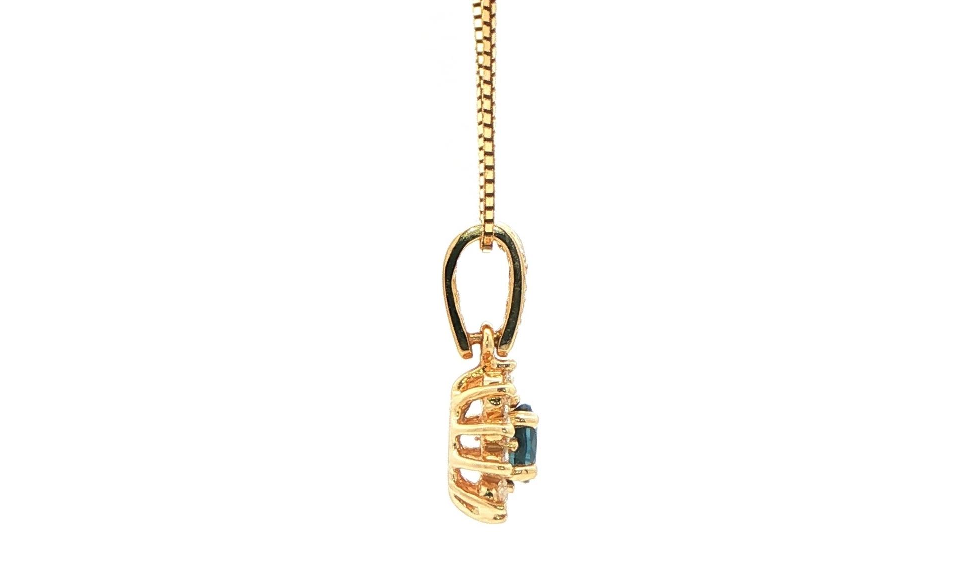 Estate Piece: Oval-cut Sapphire and Diamond Halo Pendant in Yellow Gold (0.75cts TWT) side