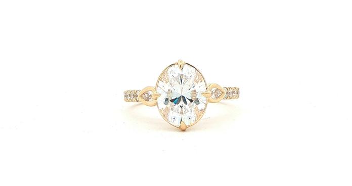 content/products/Oval-cut Center and Bezel-set Pear-cut Sides Engagement Ring Mounting with Pav&eacute; Accents in Yellow Gold (0.50cts TWT)