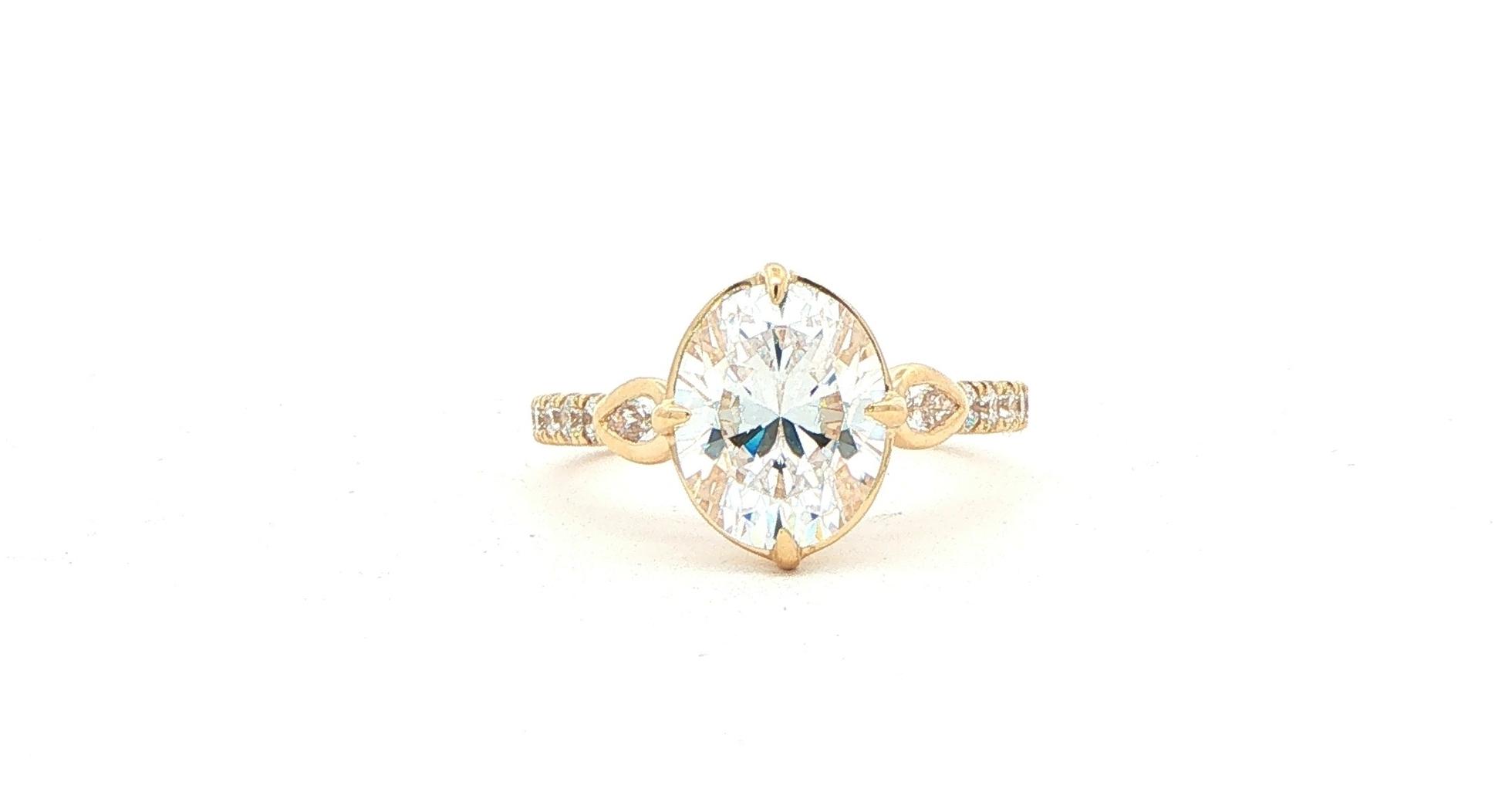 Oval-cut Center and Bezel-set Pear-cut Sides Engagement Ring Mounting with Pav&eacute; Accents in Yellow Gold (0.50cts TWT)