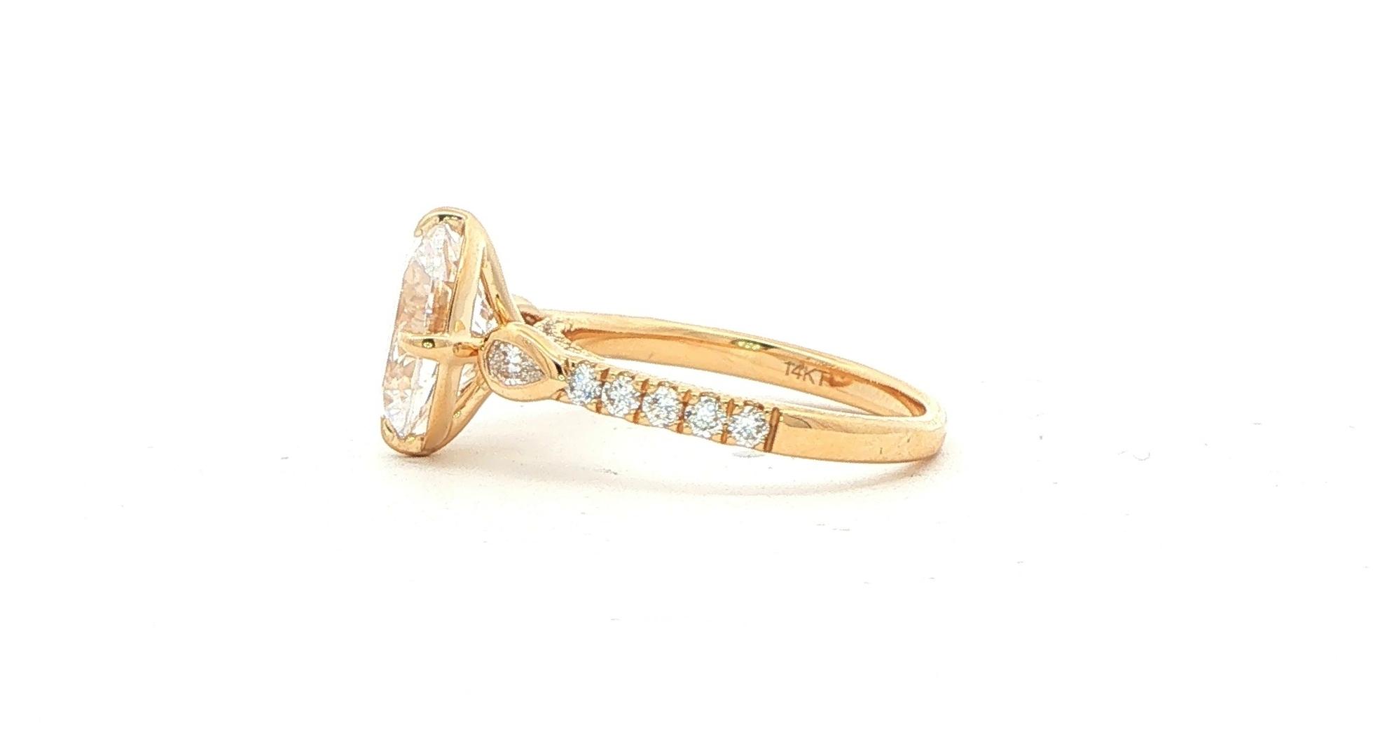 Oval-cut Center and Bezel-set Pear-cut Sides Engagement Ring Mounting with Pav&eacute; Accents in Yellow Gold (0.50cts TWT) side