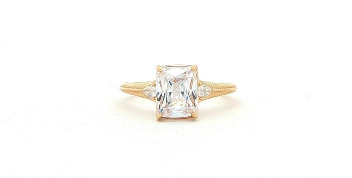 content/products/3-Stone Cushion-cut Center and Pear-cut Sides Engagement Ring Mounting with Engraved Details in Yellow Gold (0.10cts TWT)