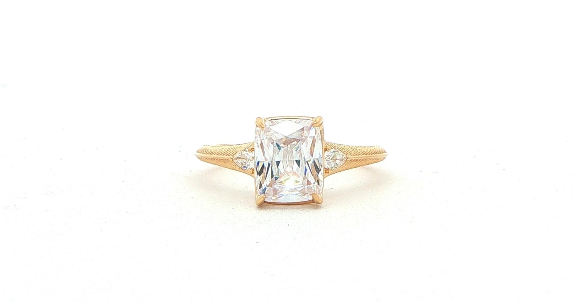 3-Stone Cushion-cut Center and Pear-cut Sides Engagement Ring Mounting with Engraved Details in Yellow Gold (0.10cts TWT)