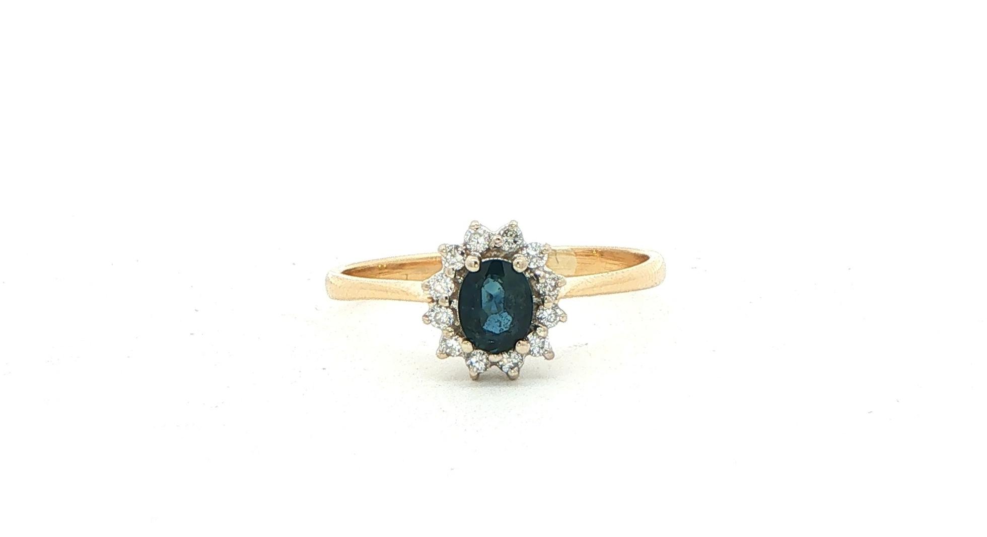 Estate Piece: Oval Deep Blue Sapphire and Diamond Halo Ring in Yellow Gold (0.60cts TWT)