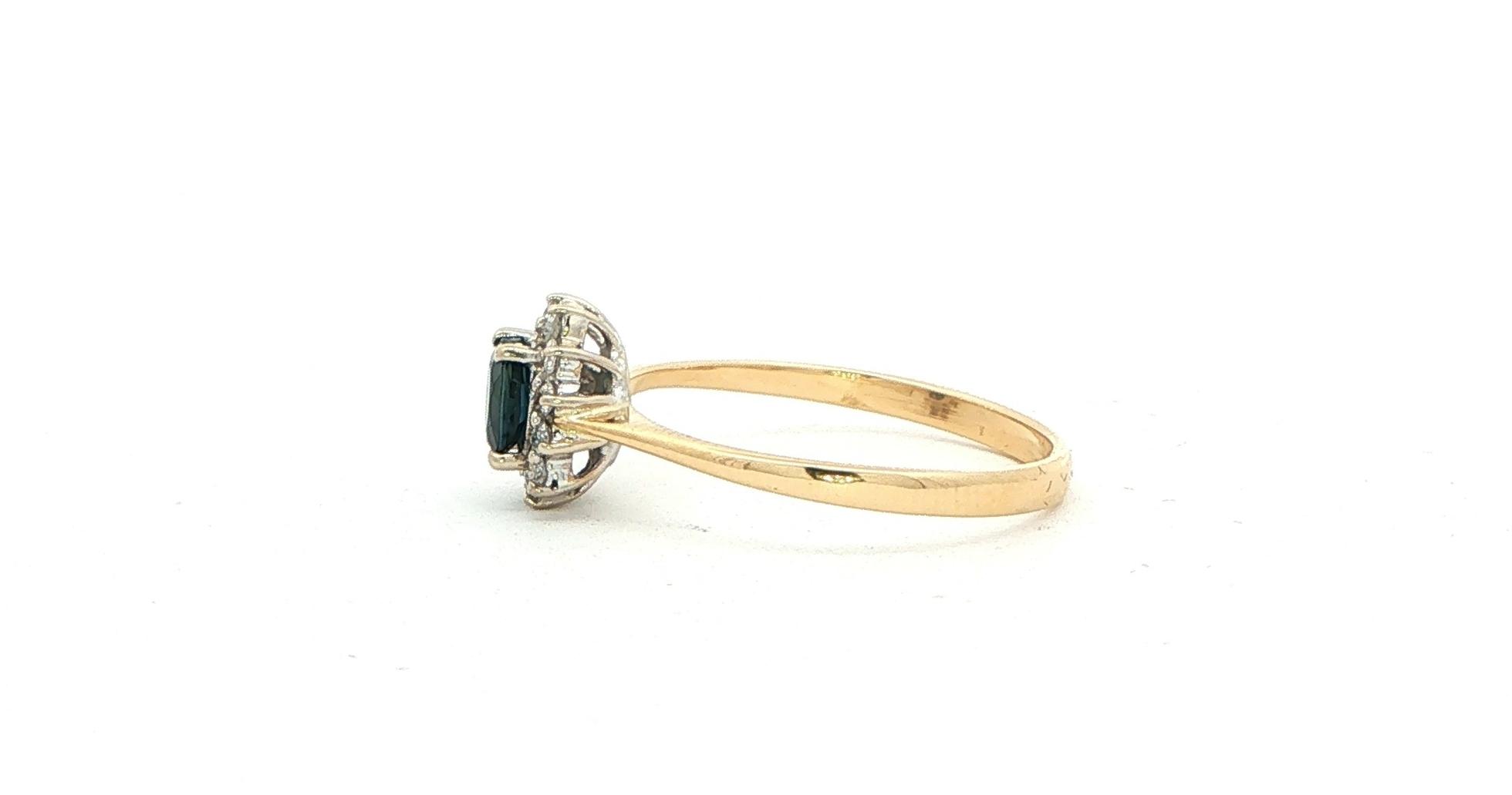 Estate Piece: Oval Deep Blue Sapphire and Diamond Halo Ring in Yellow Gold (0.60cts TWT) side