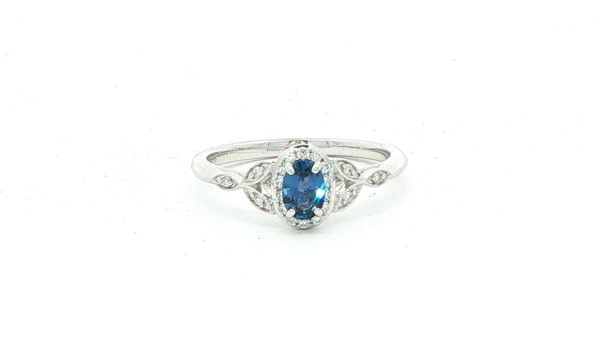 Montana Yogo Sapphire and Diamond Halo Ring in White Gold (0.43cts TWT)