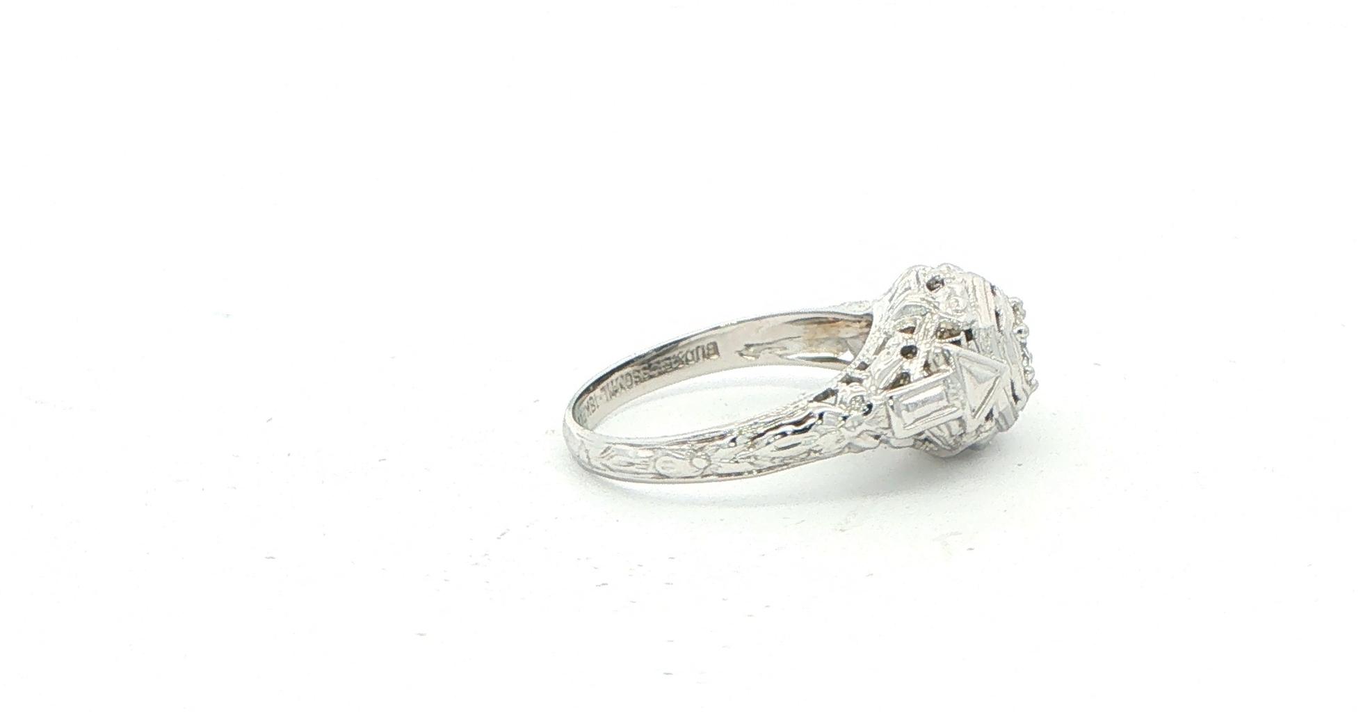 Estate Piece: Antique Bead Bright Diamond Solitaire Ring in White Gold (0.25cts) side