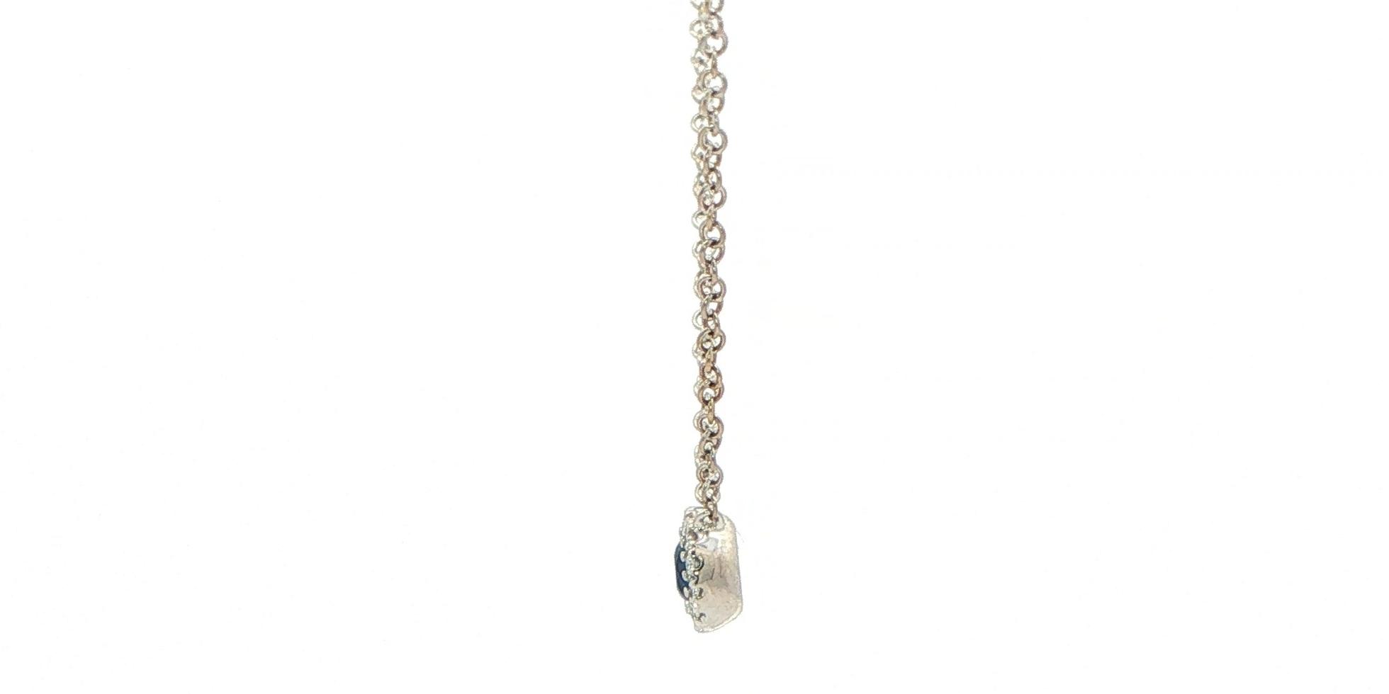 Estate Piece: Royal Blue Sapphire Halo Pendant Necklace in White Gold (0.25cts TWT) side