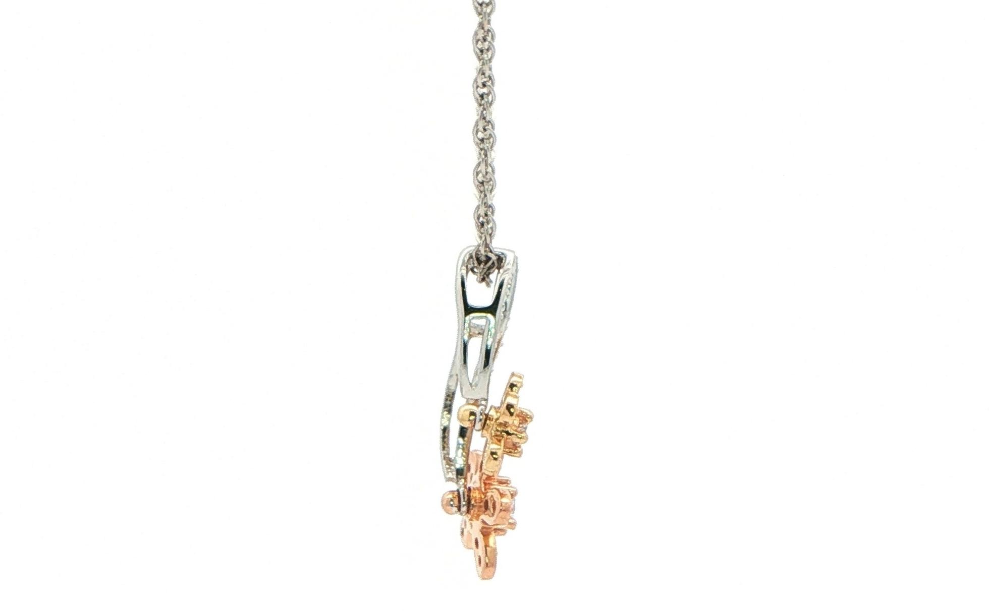 Estate Piece: Spinning Double Floral Diamond Charm Necklace in Tri-Tone White, Yellow, and Rose Gold (0.25cts TWT) side