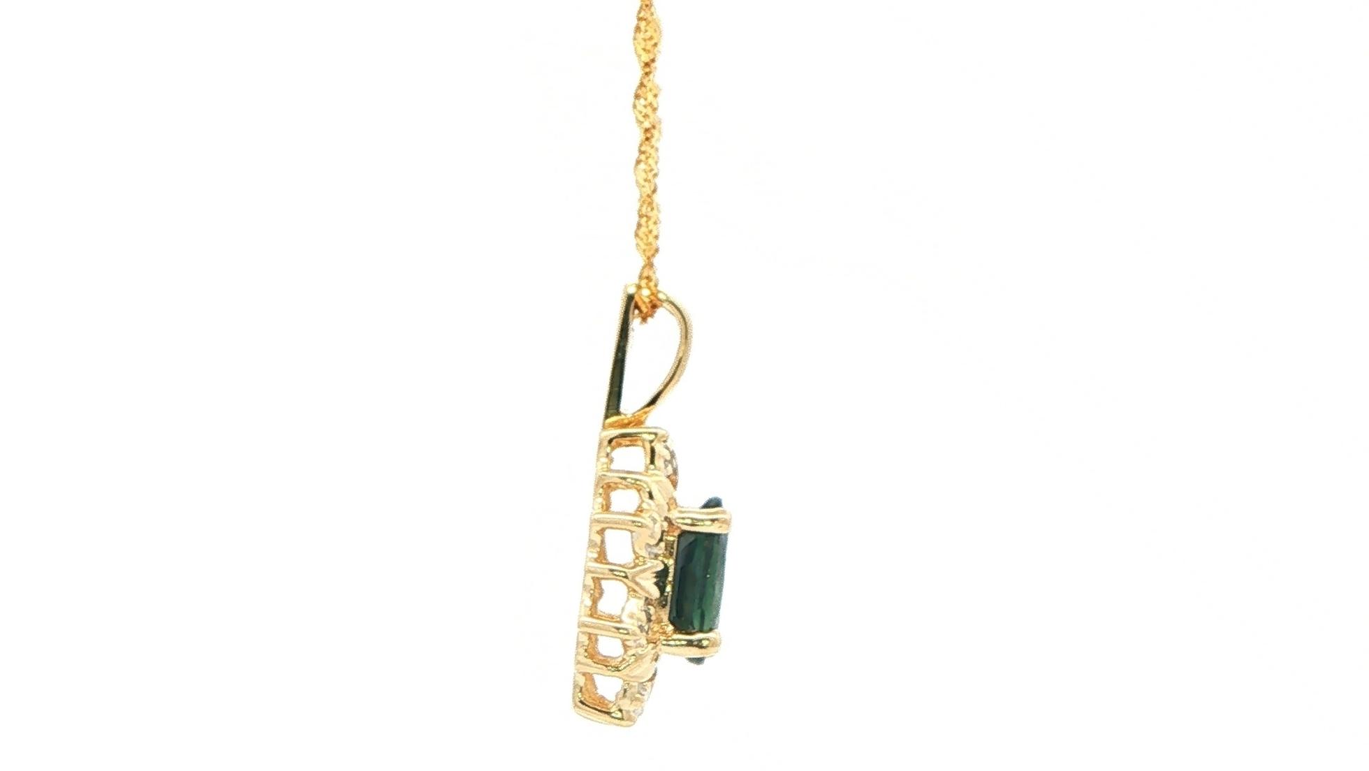 Estate Piece: Halo-style Oval-cut Sapphire and Diamond Pendant in Yellow Gold (1.03cts TWT) side