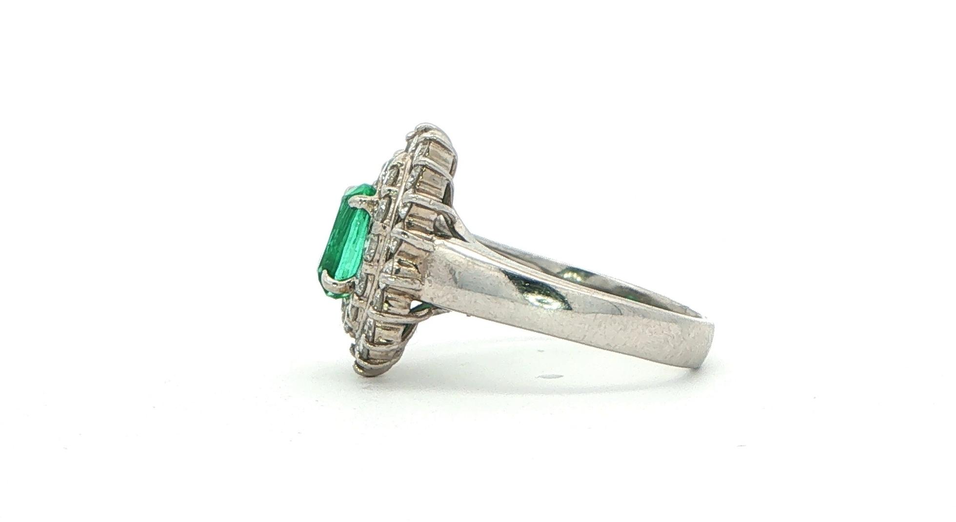 Estate Piece: Oval Emerald Double Diamond Halo Cocktail Ring in Platinum (2.00cts TWT) side