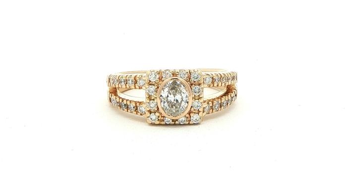 content/products/Estate Piece: Bezel-set Oval Diamond Halo Split Shank Engagement Ring in Yellow Gold (0.80cts TWT)