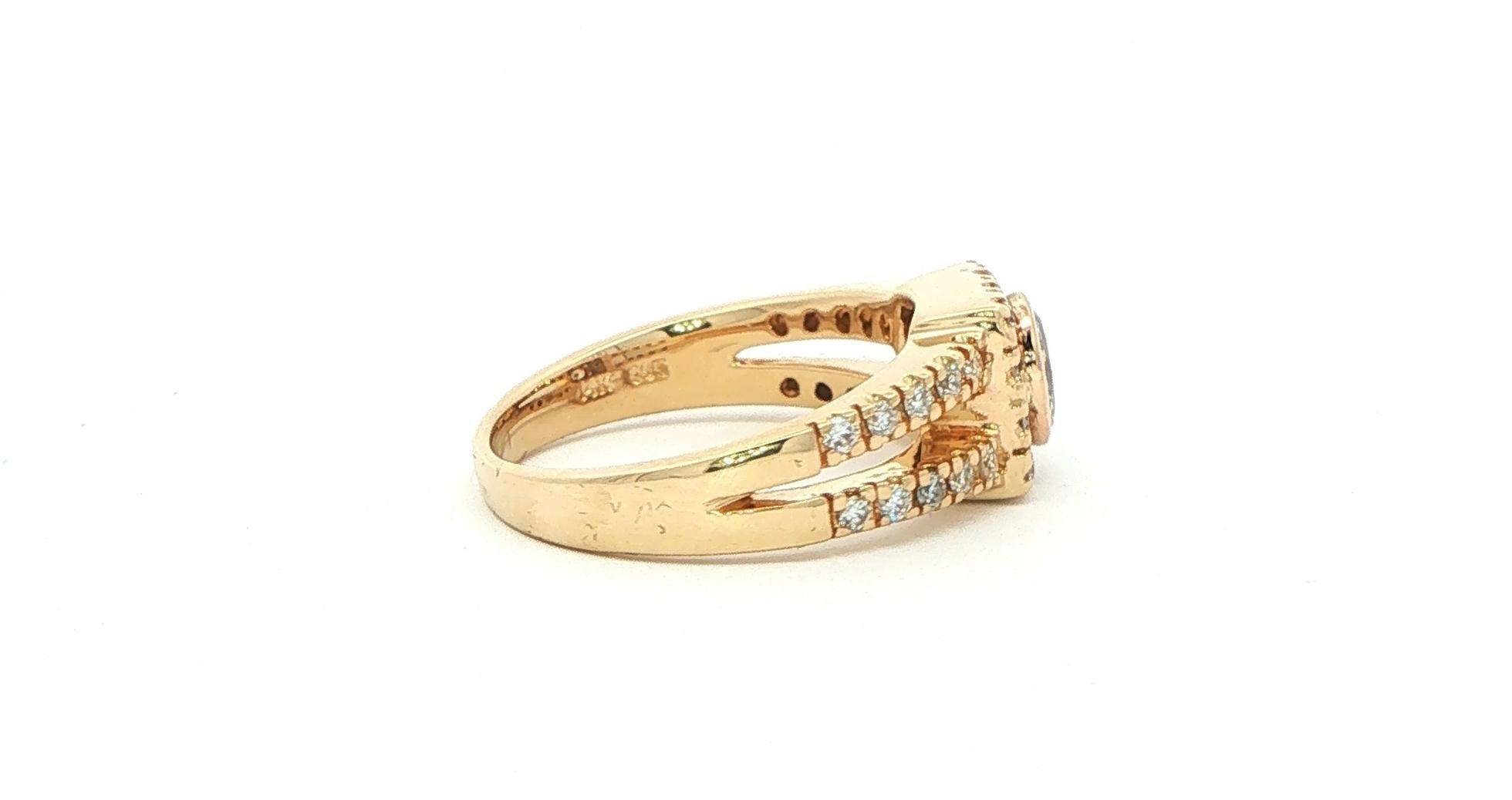 Estate Piece: Bezel-set Oval Diamond Halo Split Shank Engagement Ring in Yellow Gold (0.80cts TWT) side