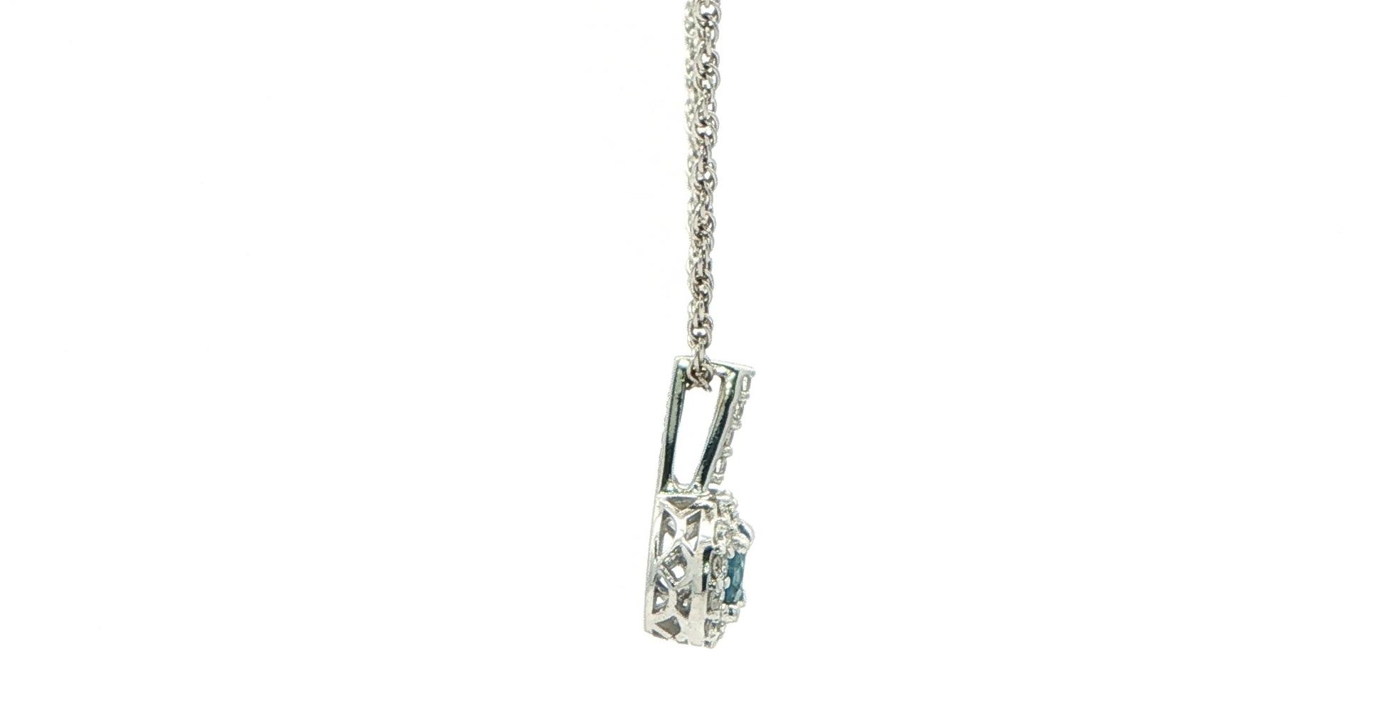 Estate Piece: Deep Blue Montana Sapphire Halo Pendant Necklace in White Gold (0.45cts TWT) side