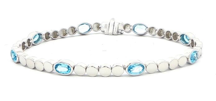 content/products/Oval Blue Topaz Station Line Bracelet in Sterling Silver (4.60cts TWT)