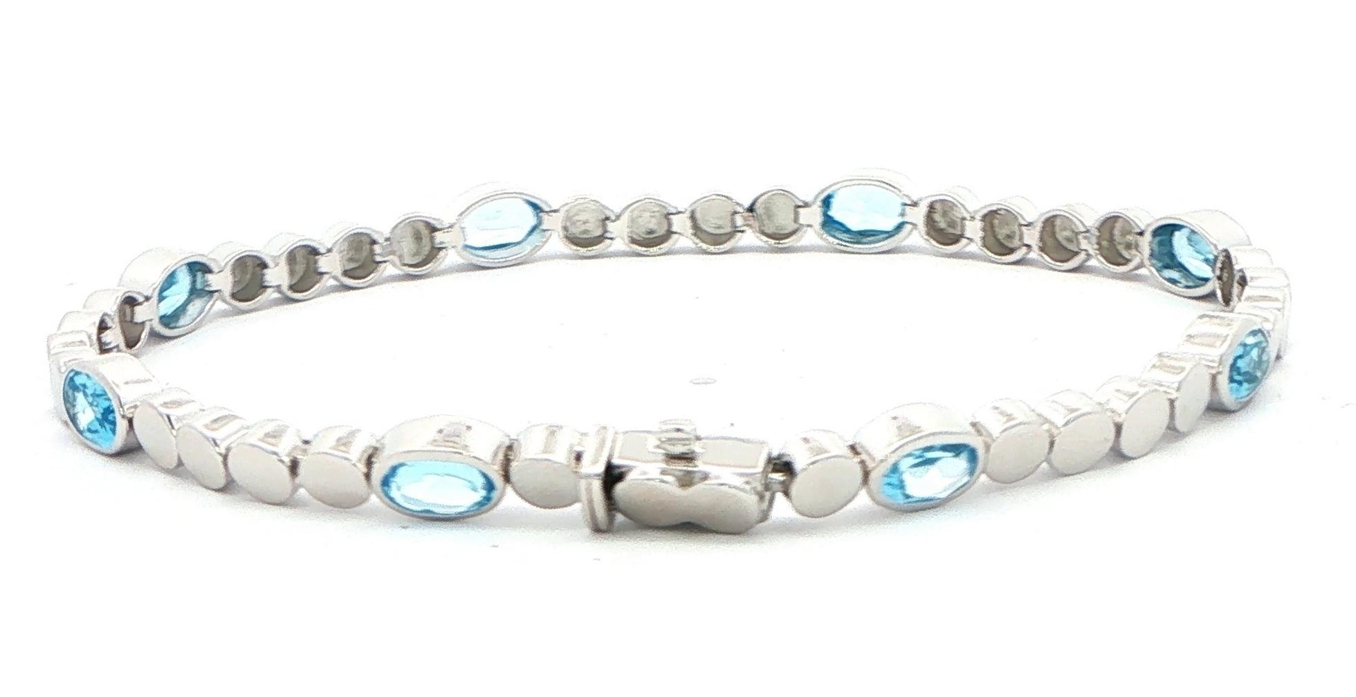 Oval Blue Topaz Station Line Bracelet in Sterling Silver (4.60cts TWT) back
