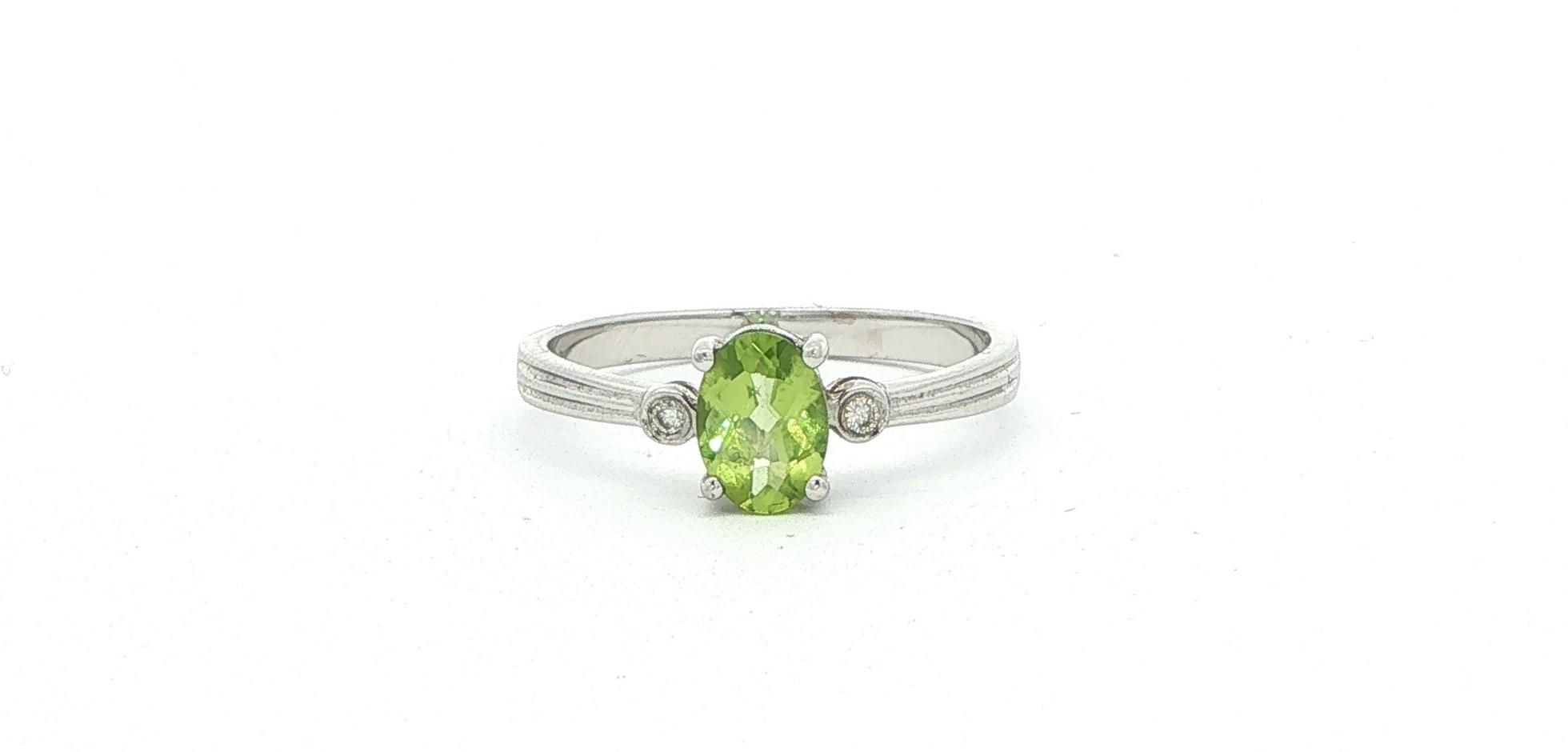 Oval Peridot and Diamond Three-Stone Ring in White Gold