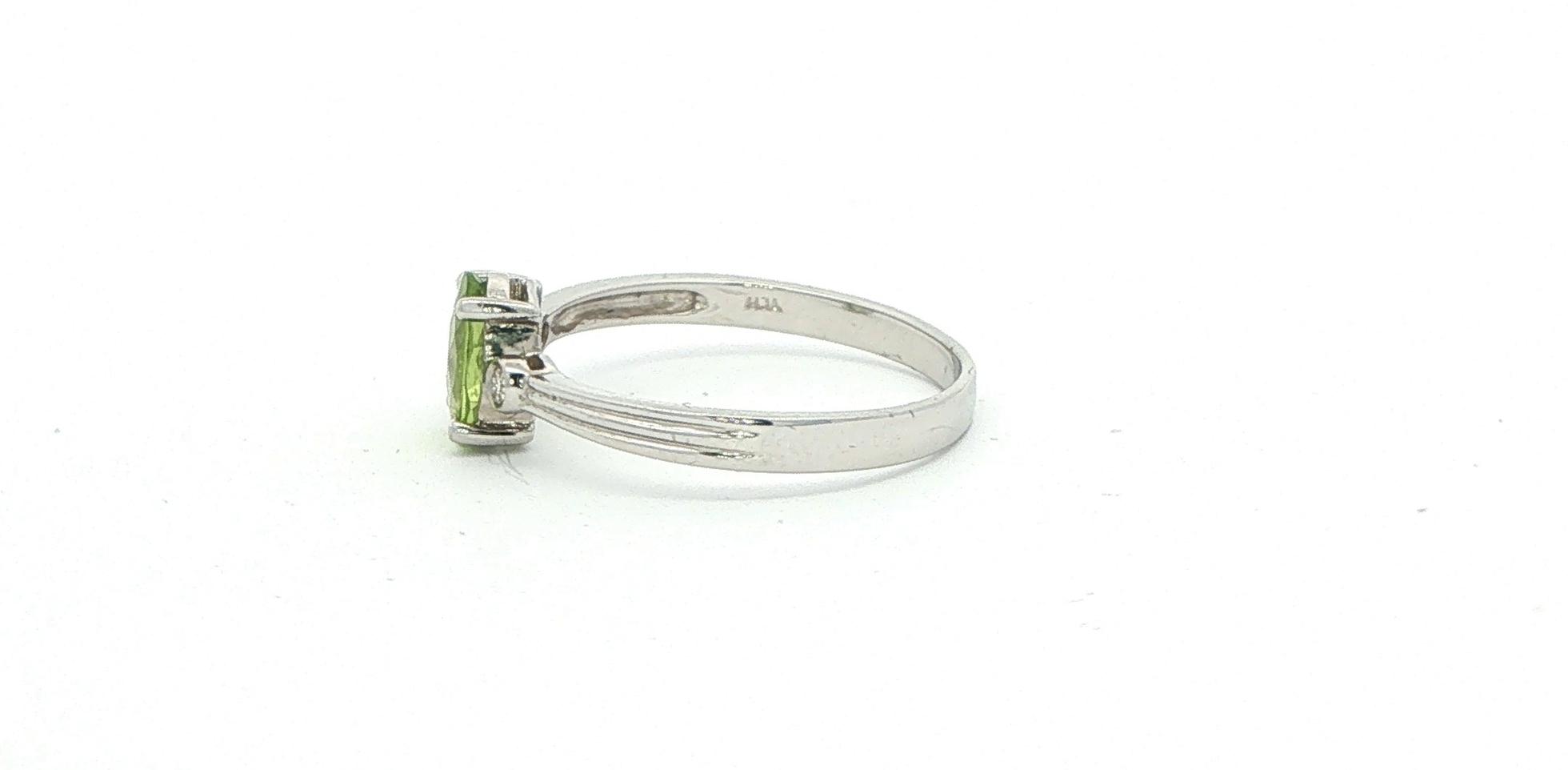 Oval Peridot and Diamond Three-Stone Ring in White Gold side