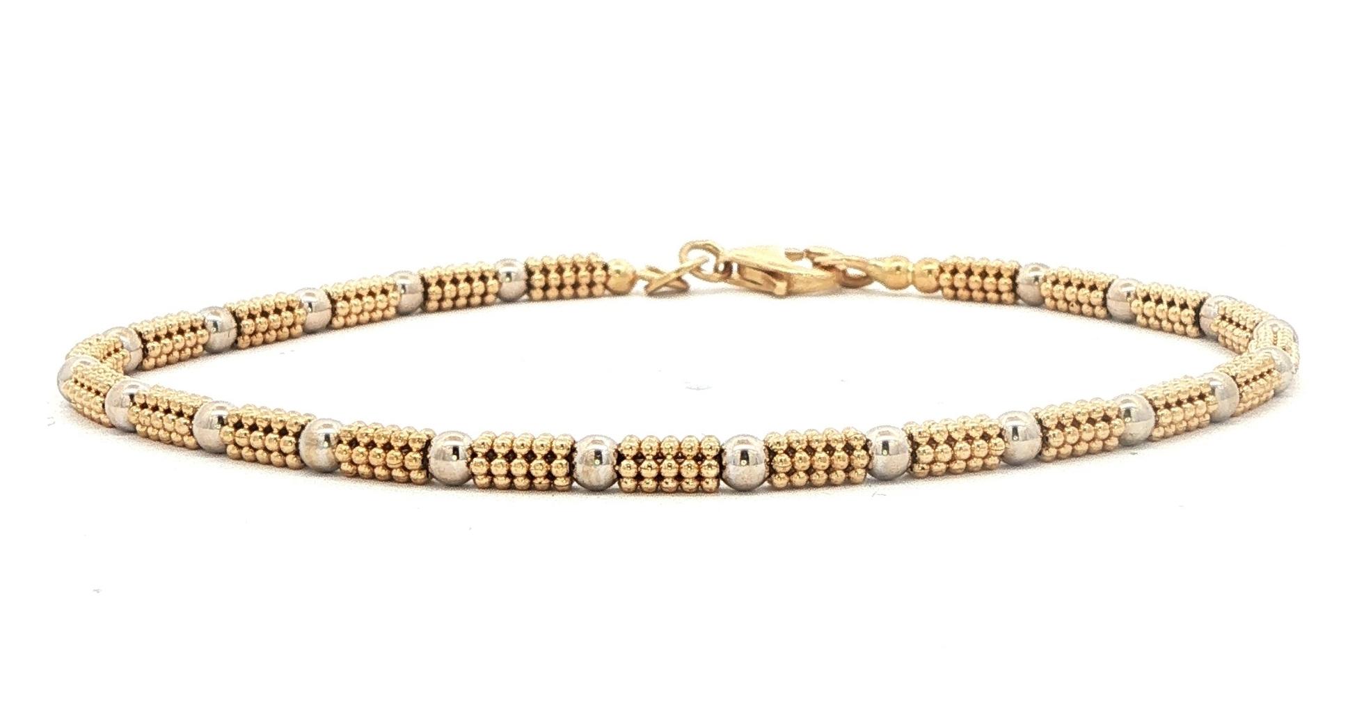 Estate Piece: Textured and Smooth Beaded Bracelet in Two-tone Yellow and White Gold
