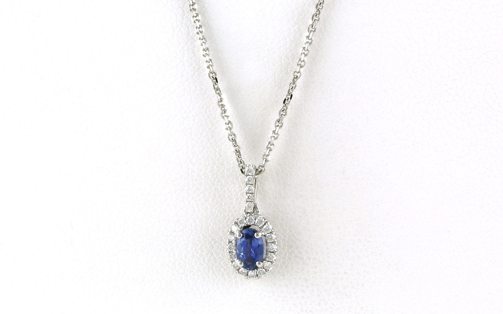 Oval Montana Yogo Sapphire and Diamond Halo Necklace in White Gold (0.43cts TWT)