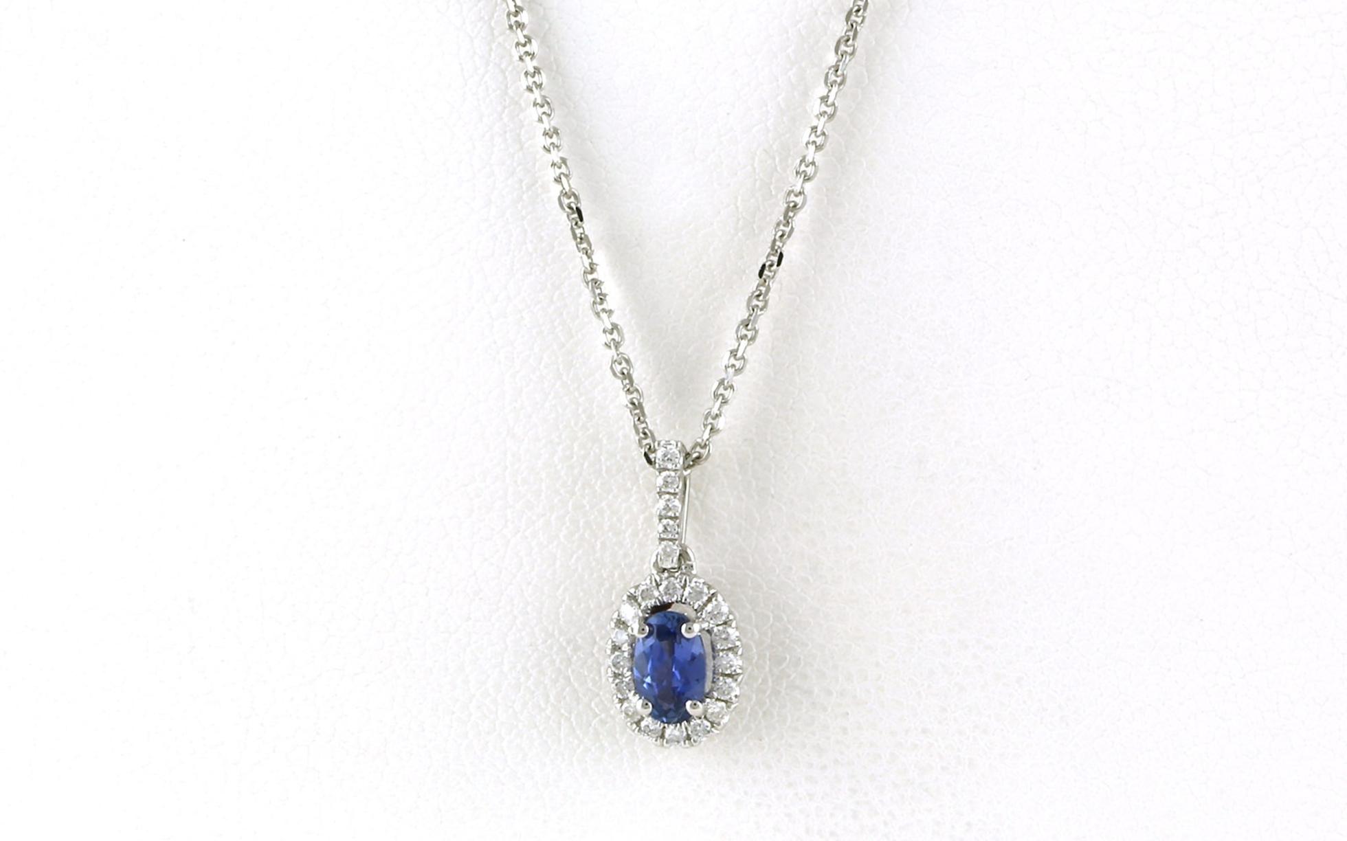 Oval Montana Yogo Sapphire and Diamond Halo Necklace in White Gold (0.43cts TWT)