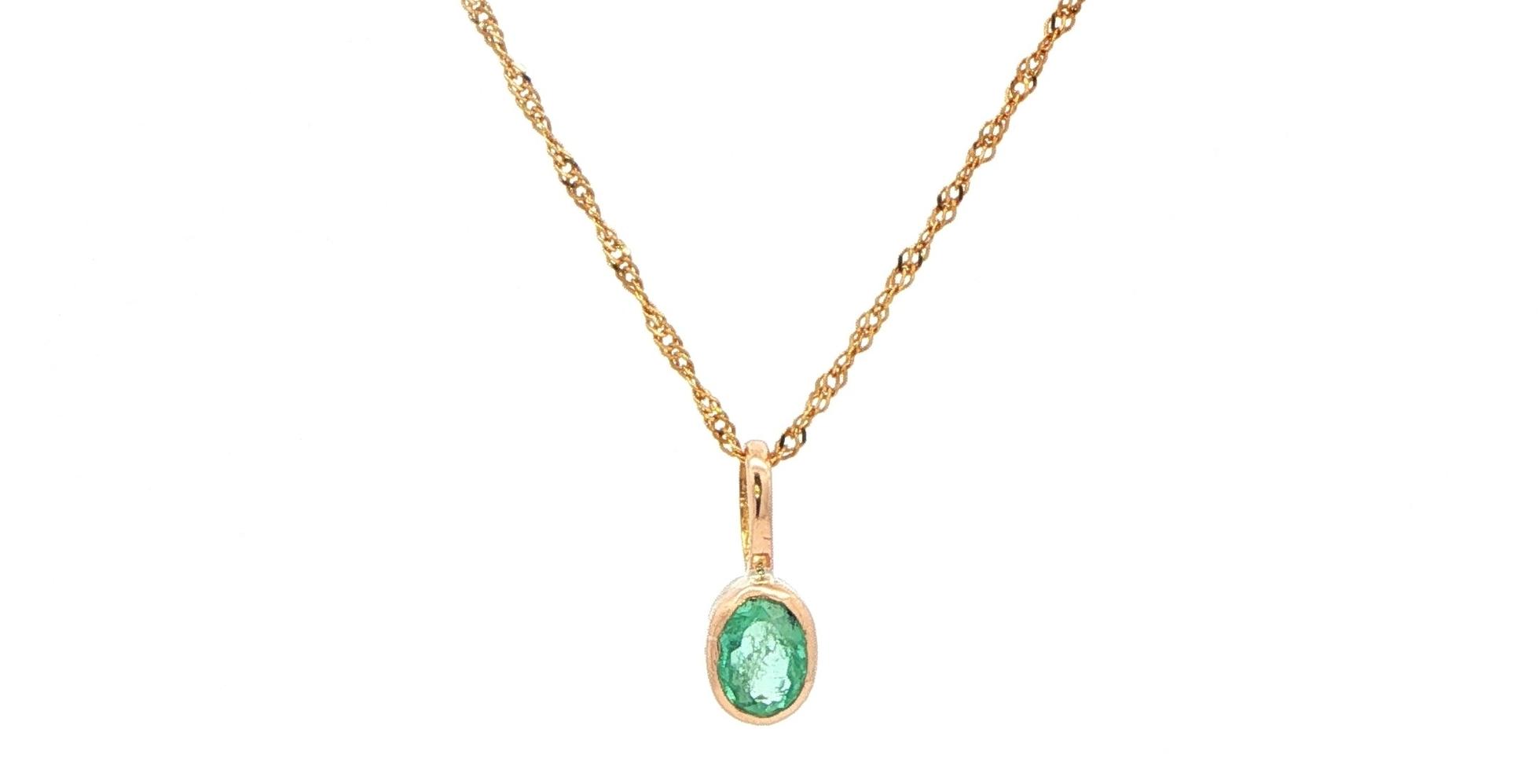 Estate Piece: Oval Emerald Bezel Pendant Necklace in Yellow Gold 
