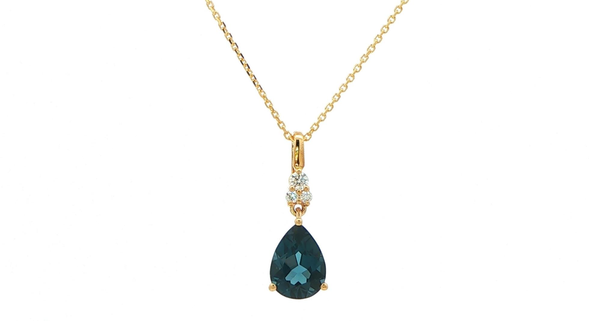 Pear-Cut London Blue Topaz Pendant Necklace with Diamond Cluster Accent in Yellow Gold (1.45cts TWT)
