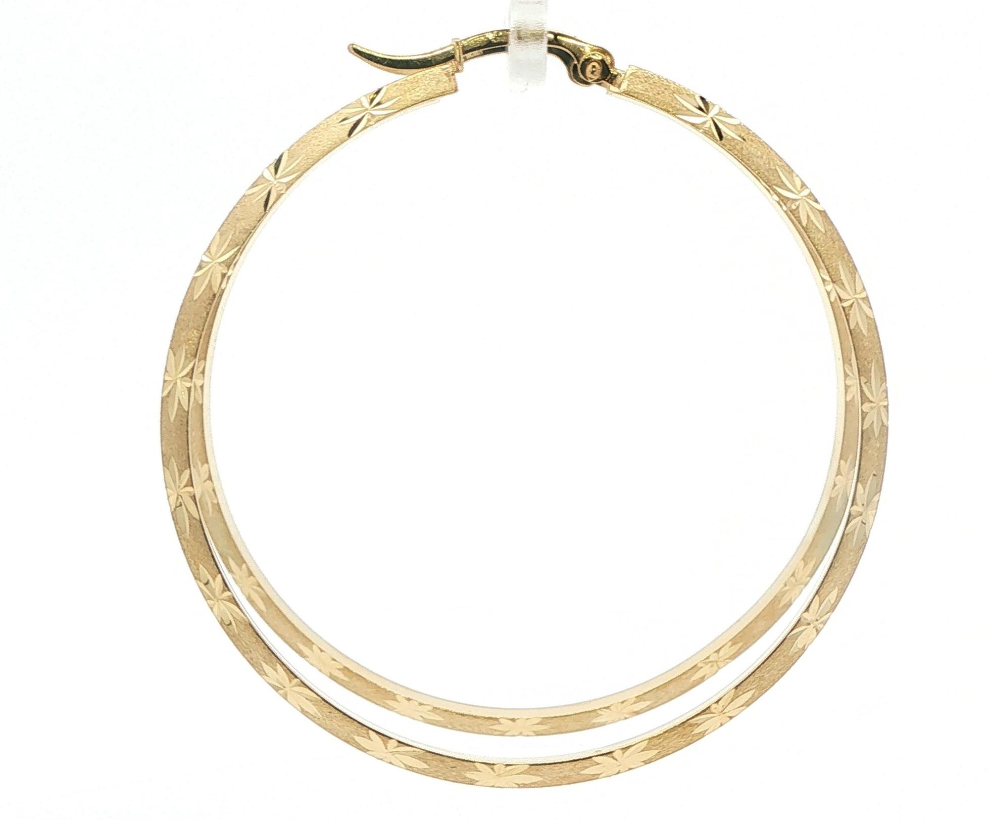 Beveled Hoop Earrings with Textured Starbursts in Yellow Gold  side