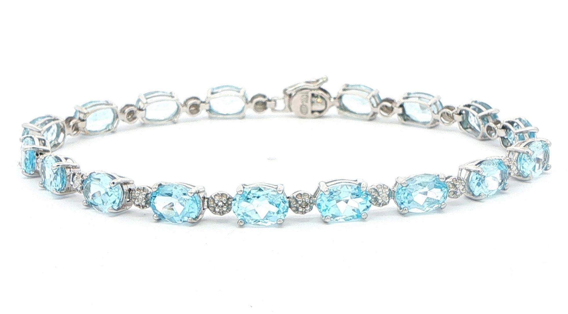 Estate Piece: Oval Sky Blue Topaz Tennis Bracelet in White Gold