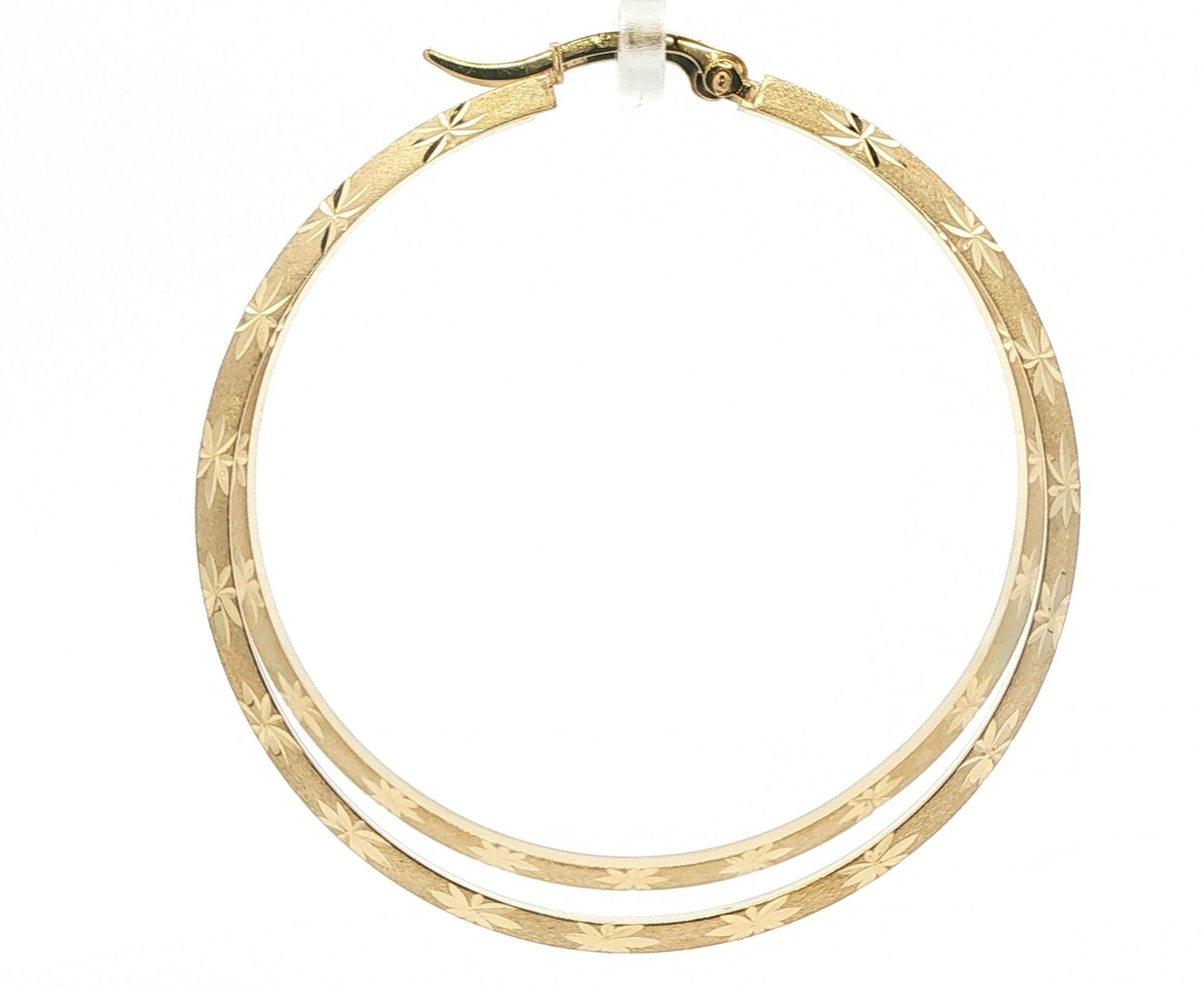 Beveled Hoop Earrings with Textured Starbursts in Yellow Gold  back