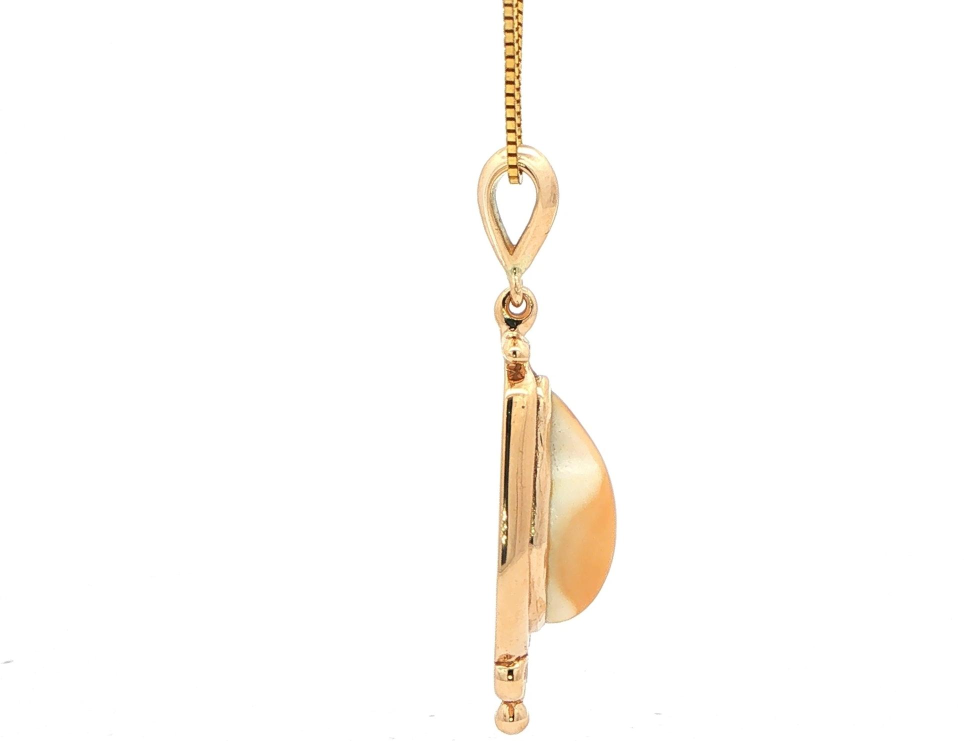 Estate Piece: Elk Ivory Pendant Necklace with Diamond Accents in Yellow Gold  side