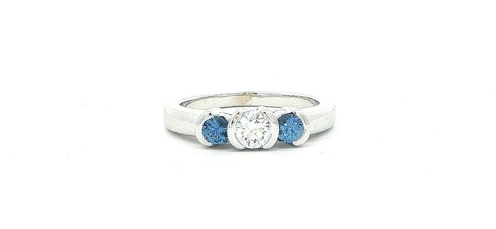 content/products/Three-Stone Diamond and Montana Yogo Sapphire Split-Bezel Ring in White Gold (0.58cts TWT)
