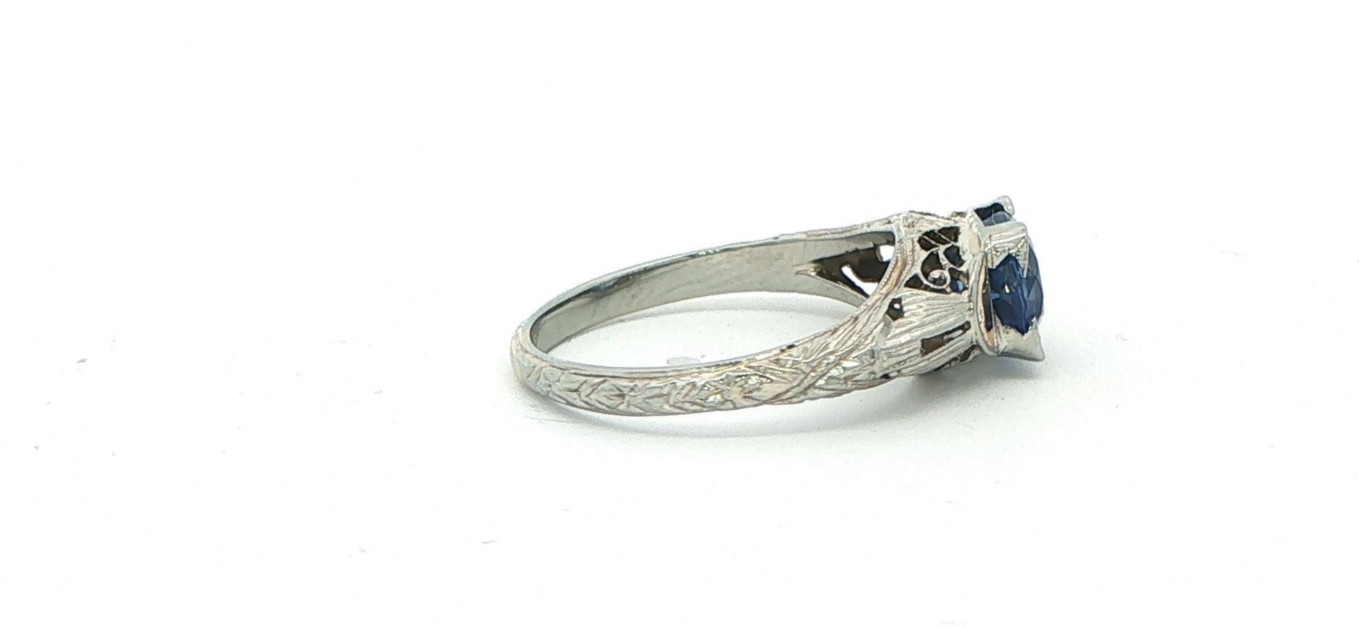 Estate Piece: Vintage Filigree East-West Oval Sapphire Solitaire Ring in White Gold (1.25cts TWT) side